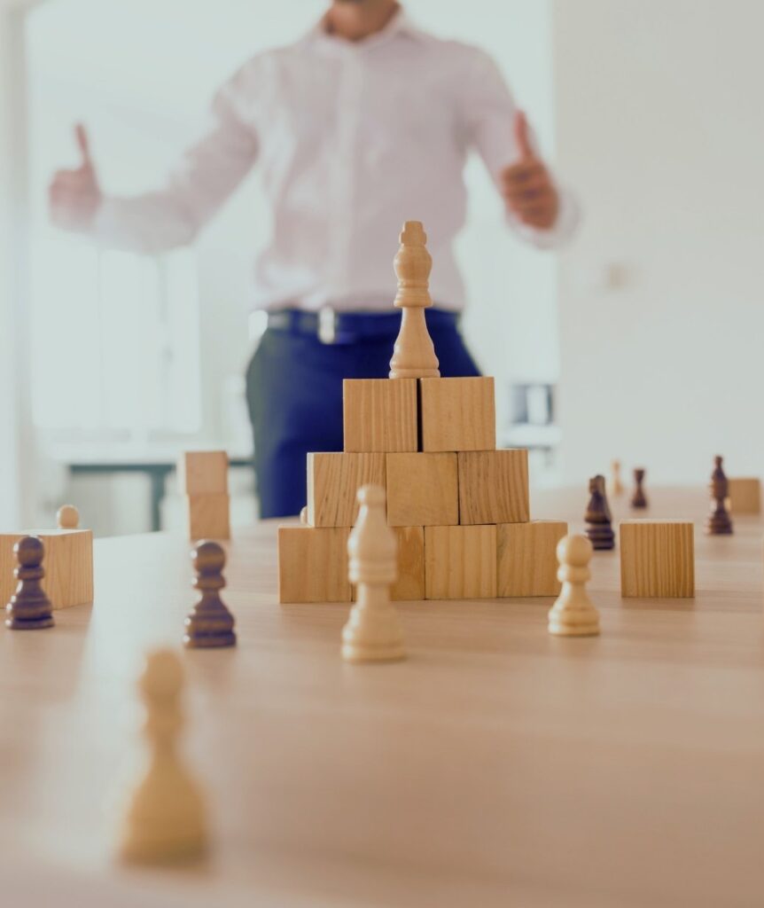 Strategy blocks and chess pieces symbolising self leadership, ownership, and proactive career growth.