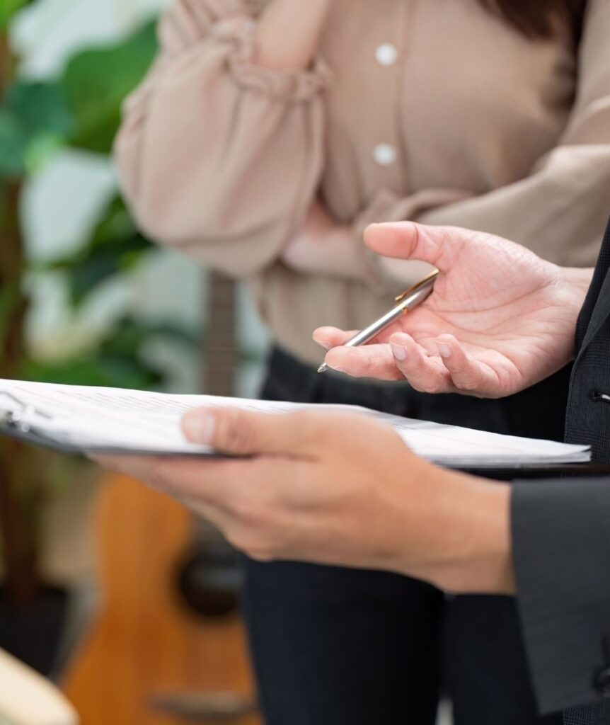 Advisor reviewing philanthropy documents with a client during a legacy planning conversation.